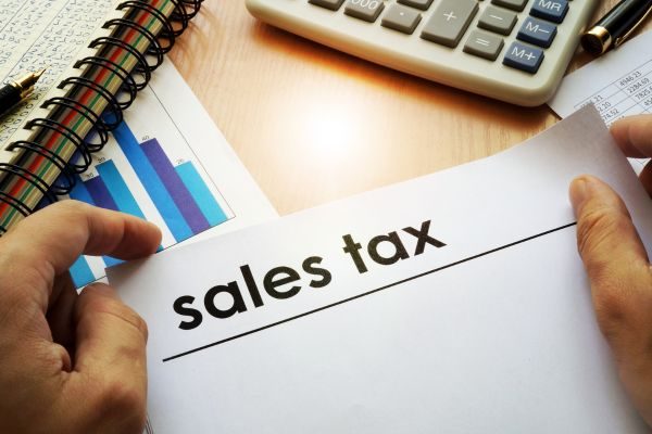 NetSuite, Shopify, Avalara Image of a business person studying sales reports